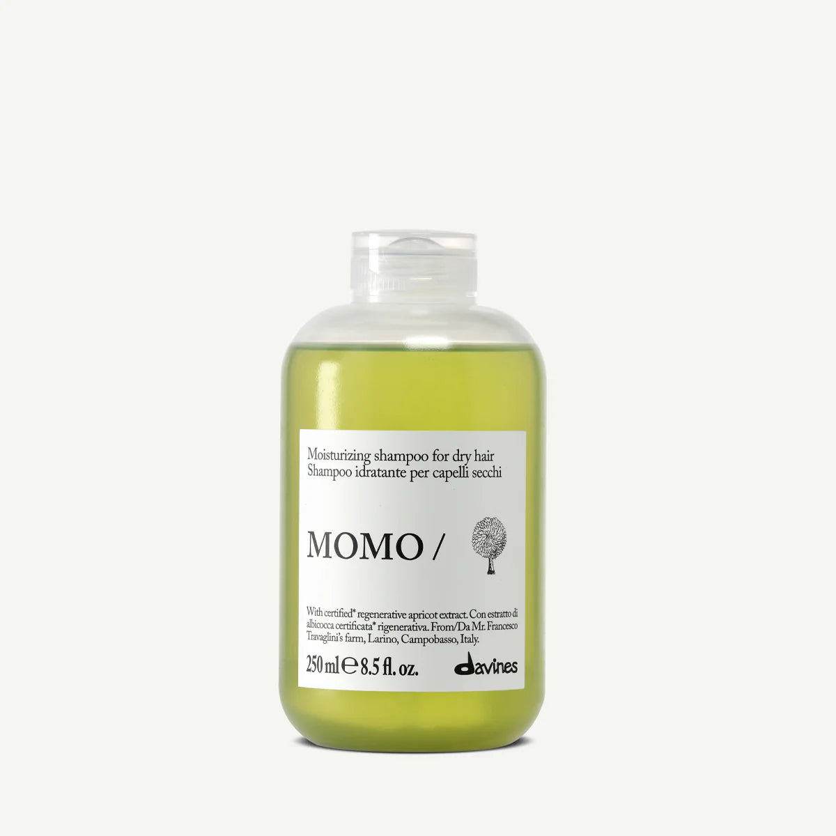 Shampoo bottle labeled 'MOMO/' on a white background